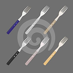 Set of forks. Metallic, wooden forks.